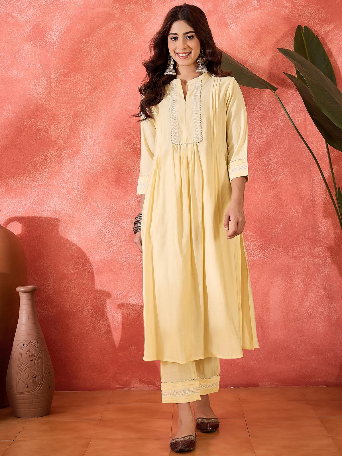 Women Cream Solid Kurta with Trousers