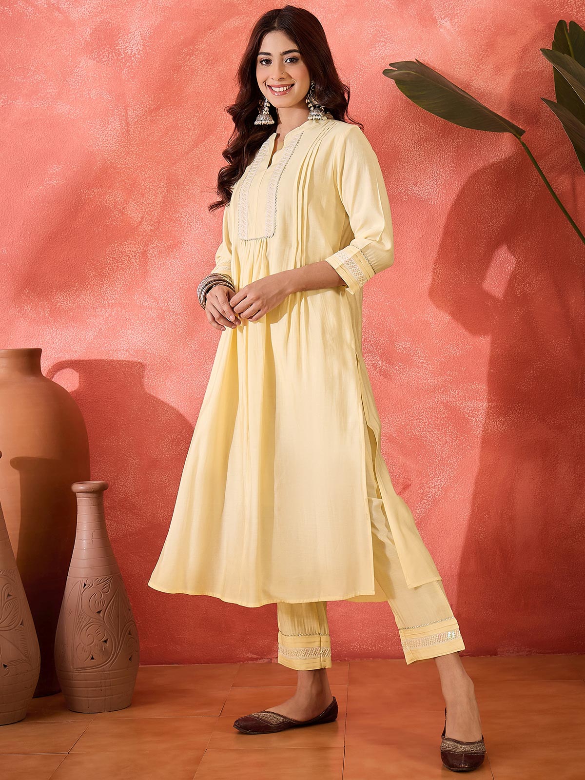 Women Cream Solid Kurta with Trousers